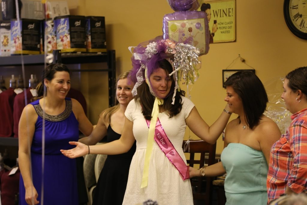 image of bride wearing bridal shower bonnet at her winery bridal shower at your own winery