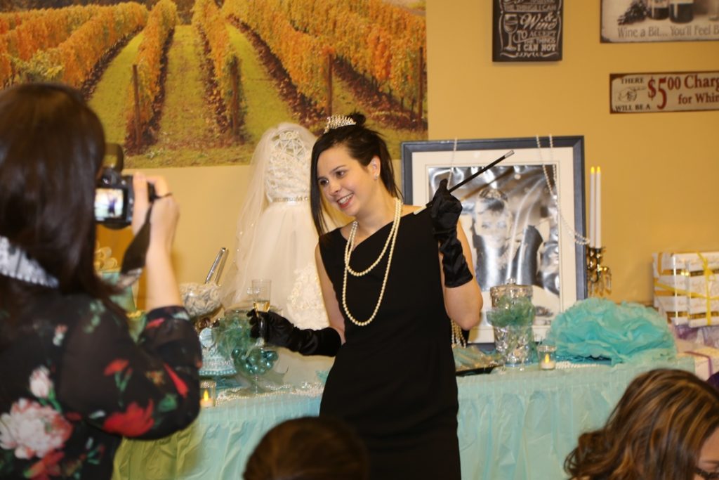 image of the bride dressed as Audrey Hepburn for her  Breakfast at Tiffany's themed Bridal Shower