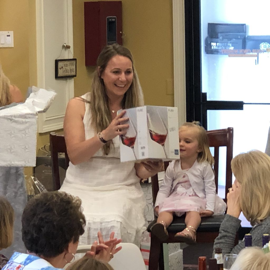 image of bride opening gifts at her bridal shower at your own winery