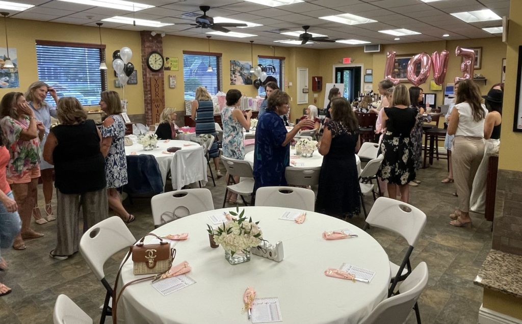 image of guests socializing for bride shower at your own winery